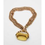 An antique 9ct gold watch chain bracelet with citrine fob seal charm.