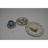Two Meissen plates and a tea cup and saucer.