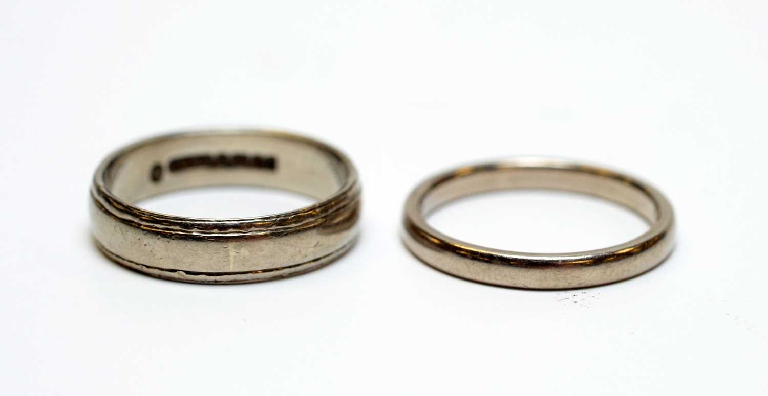 Two 18ct white gold wedding bands.