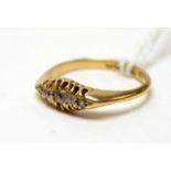 An antique 18ct gold and five stone diamond ring.