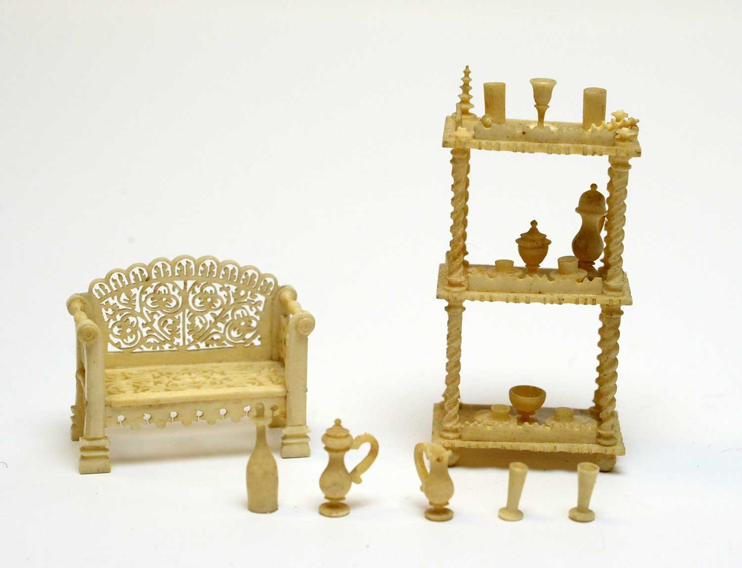19th Century carved ivory miniatures.
