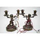 Pair of bronzed two-branch figural table lamps