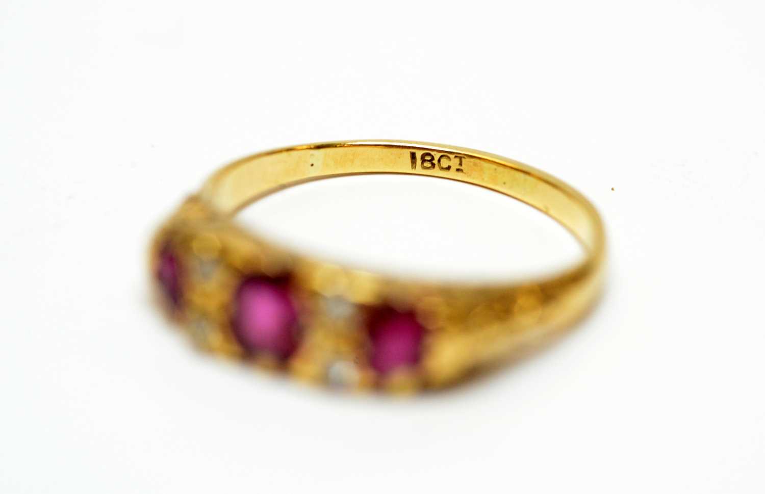 A three-stone ruby and diamond dress ring. - Image 2 of 2