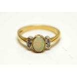 An opal and diamond ring.