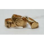 A lady's 9ct gold heart-shaped signet ring; and two gold belt buckle rings.