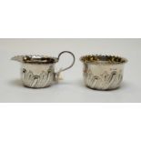A Victorian silver milk jug and sugar bowl.