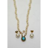 A cultured pearl two-strand necklace with diamond and turquoise clasp.