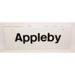 An Appleby white and black painted metal station sign,