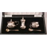 An Elizabeth II cased silver condiment set.