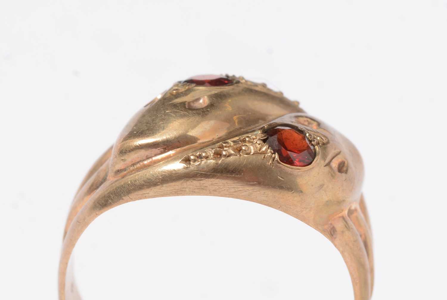 A vintage 9ct gold and garnet serpent ring.