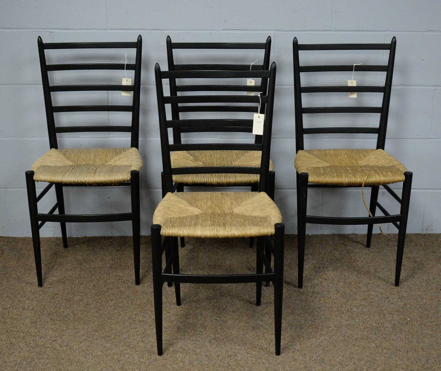 A set of four dining chairs in the manner of Gio Ponti.