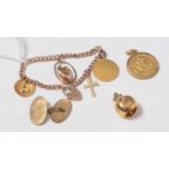 A child's 9ct gold curb-link charm bracelet suspended with charms.