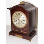 An early 20th Century stained mahogany mantel clock