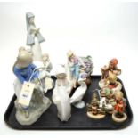 Selection of decorative ceramic figures including Hummel and Lladro