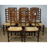 A set of eight late 19th Century beech ladder-back chairs.