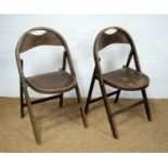 A pair of 1940's plywood folding chairs.
