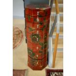 A pair of Chinese octagonal red lacquer chests of drawers.