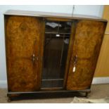 An Art Deco walnut display case.