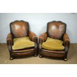 A pair of Art Deco leather tub chairs.
