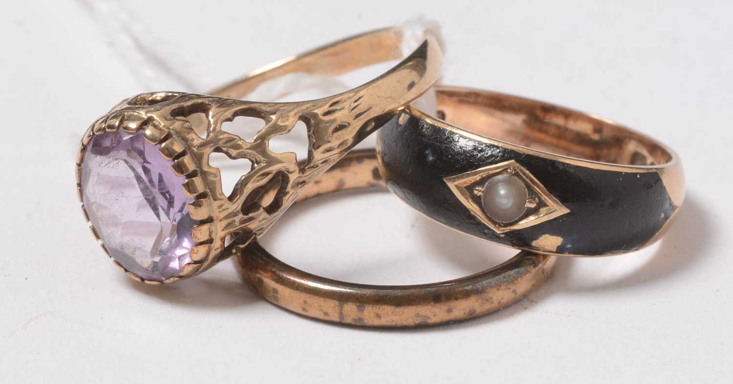 A Victorian 18ct gold mourning ring, together with two further gold rings.