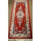 Three Persian carpets.