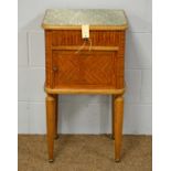 An early 20th C tulipwood and marble-topped pot cupboard.