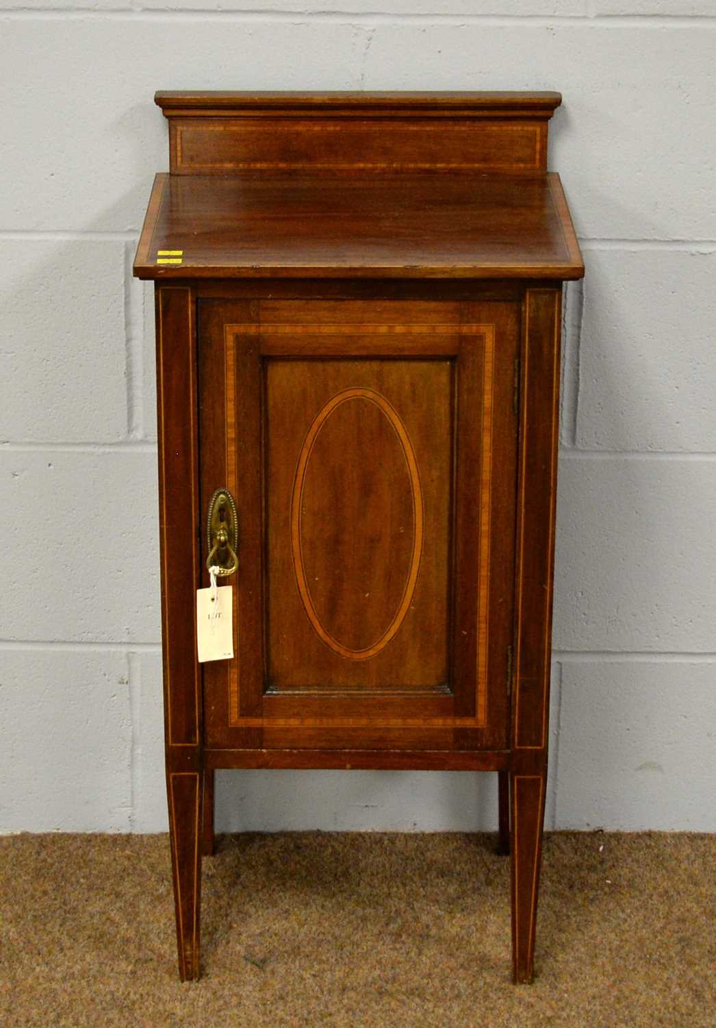 An Edwardian mahogany and inlaid nightstand.