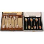 Two cased sets of silver tea/coffee spoons.