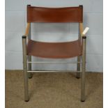 A mid Century tubular steel chair.