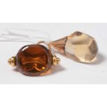 An antique 18ct gold and citrine swivel fob seal and a conforming pendant.