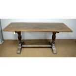 A 20th Century oak refectory dining table.