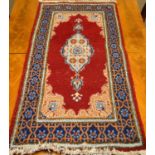 A selection of three Persian carpets.