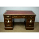 An Edwardian mahogany writing desk.