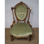 A Victorian mahogany framed nursing chair.