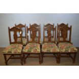 Set of eight early 20th C oak dining chairs.