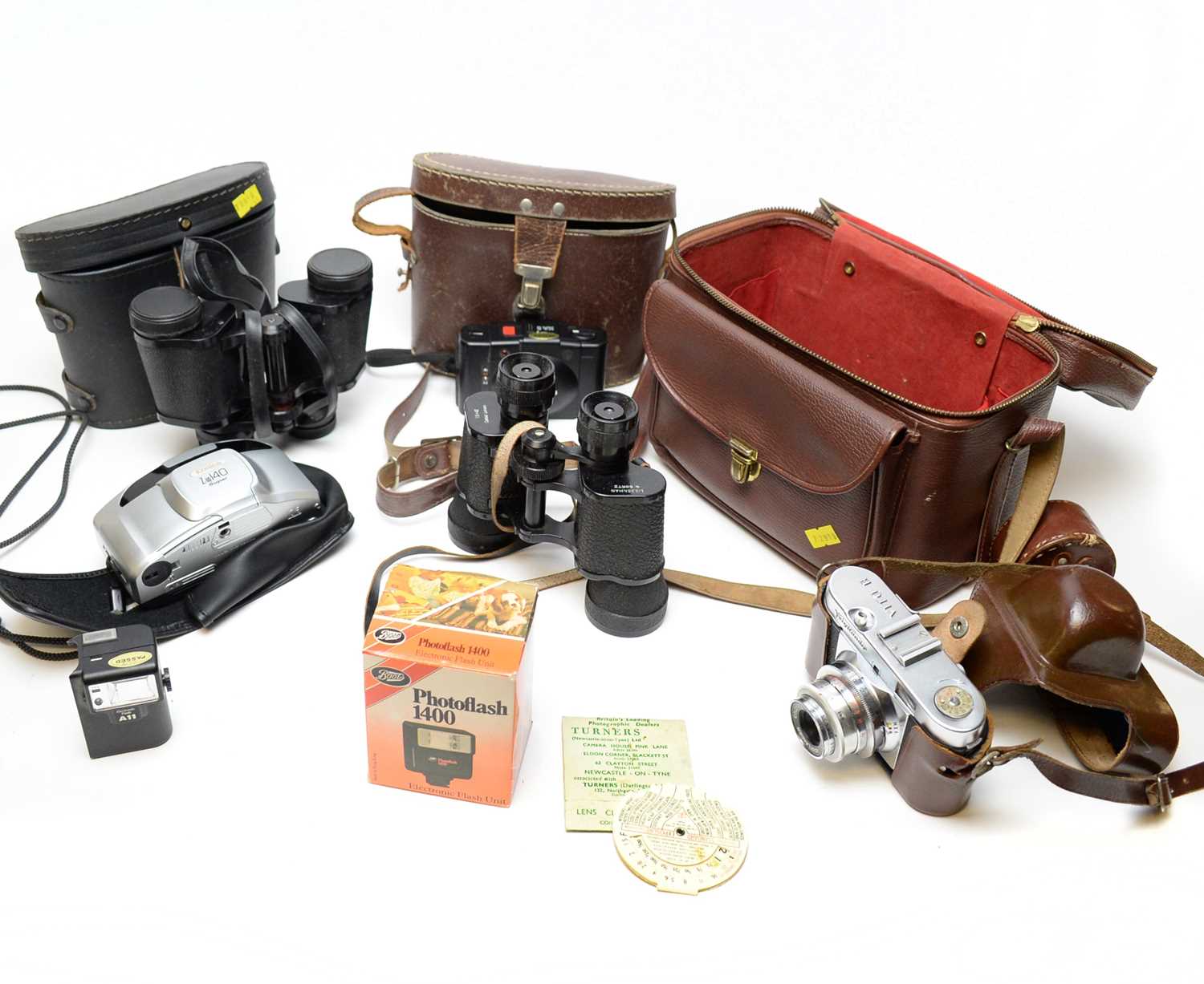 Field glasses, cameras and accessories.