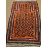 A Baluchi carpet; and a Persian carpet.