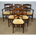 A set of six rush seat ladder-back dining chairs.