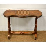 A Victorian walnut and inlaid games table