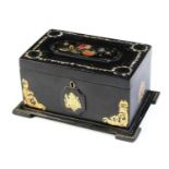 A Victorian papier mache tea caddy.