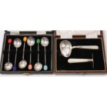 A cased set of six coffee spoons and another.