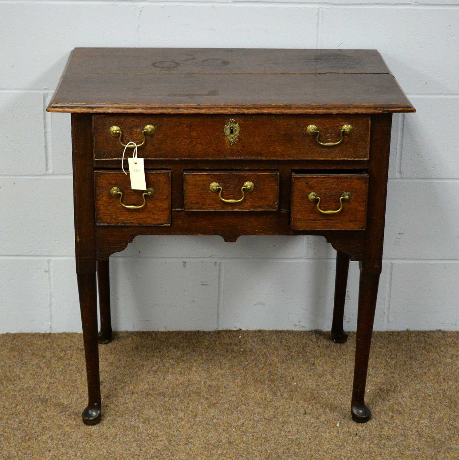 An early 19th Century oak lowboy.