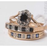 Three sapphire and diamond rings.