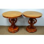 A pair of 20th Century elm circular tables.
