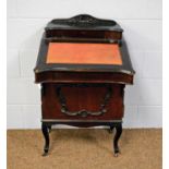 An Edwardian stained mahogany Davenport.