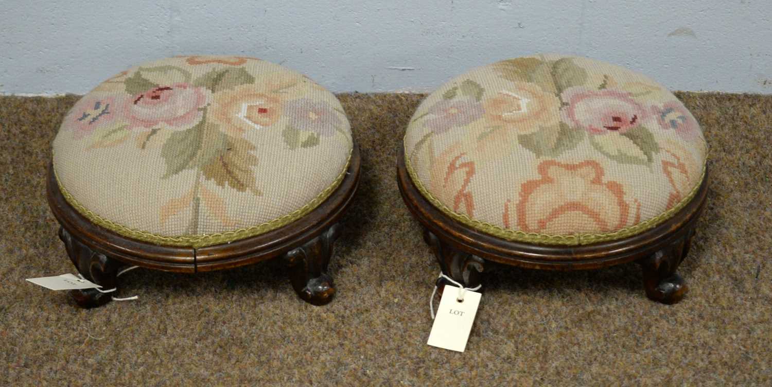 A pair of Victorian mahogany footstools.