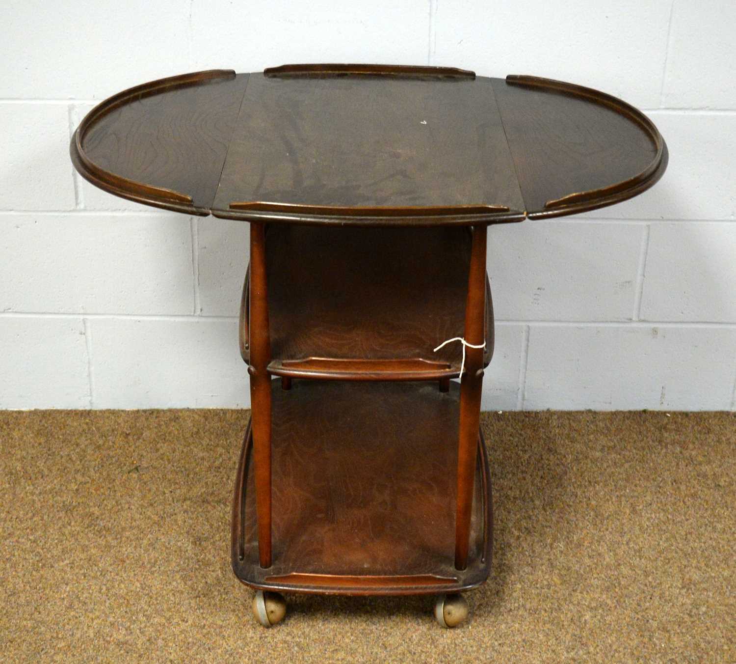 A 20th Century Ercol elm three-tier drinks trolley. - Image 2 of 2