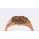 A 9ct rose gold signet ring, the shield-shaped face engraved with a monogram.