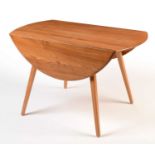 Ercol: a light beech and elm round-shaped drop-leaf dining table.