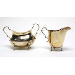 A silver cream jug and two handled sugar bowl,